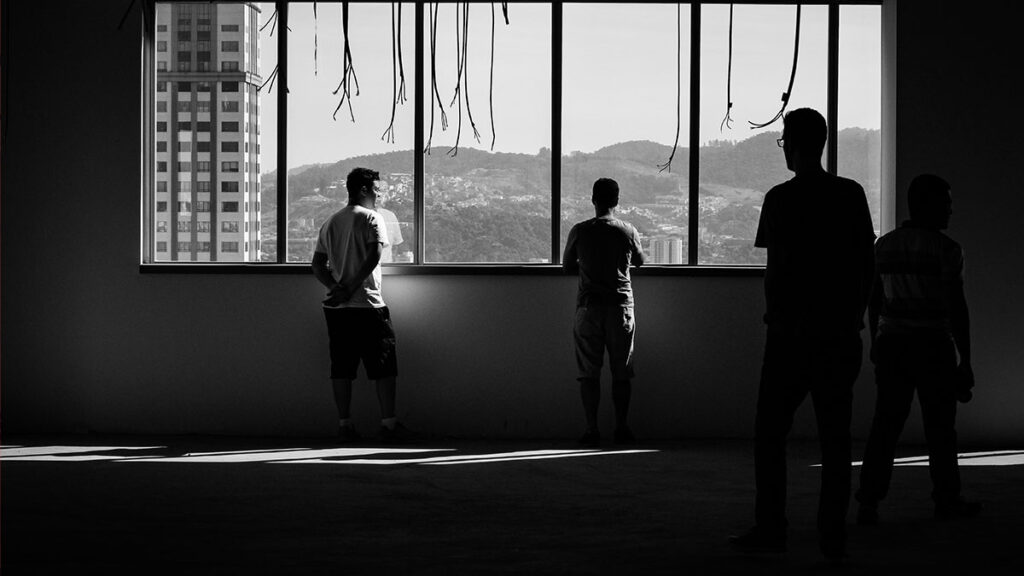 Person standing in front of a window