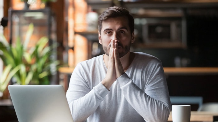 Guy Can't Focus - Laptop and Coffee In front of him